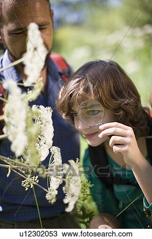 Stock Image - teacher and pupils at the wood. Fotosearch