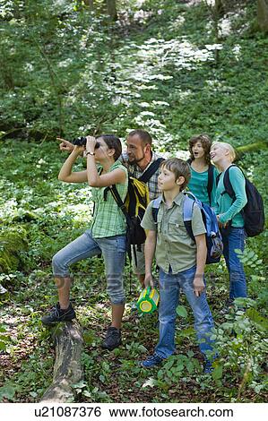Stock Photograph - teacher and pupils at the wood. Fotosearch