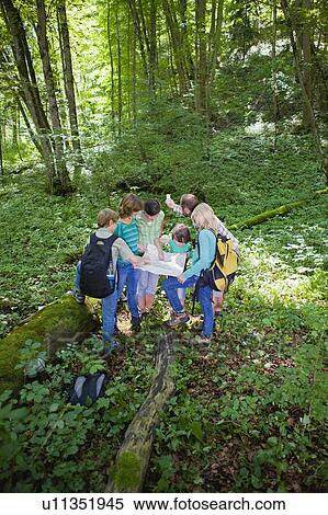 Stock Photography - teacher and pupils at the wood. Fotosearch