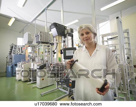 Stock Image - Technician Weaving Medical Product. Fotosearch