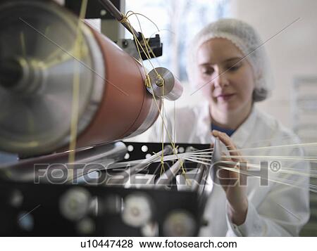 Stock Photo - Technician Weaving Medical Product. Fotosearch