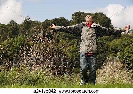 teenage boy running in field View Large Photo Image Stock Image - teenage boy running in field. Fotosearch
