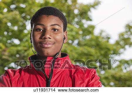 Picture - Teenage Boy wearing headphones. Fotosearch