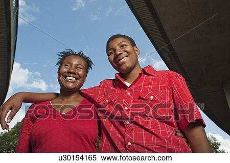 Stock Photography - Teenage Boy with mother. Fotosearch