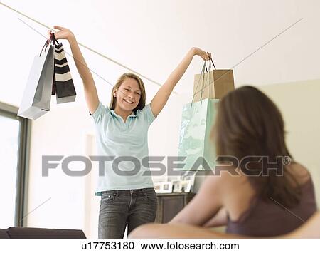 teenage girl showing shopping to mother View Large Photo Image Stock Image - teenage girl showing shopping to mother. Fotosearch