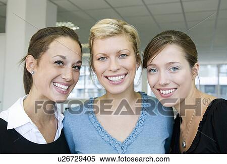 Three female business colleagues smiling View Large Photo Image Stock Photography - Three female business colleagues smiling. Fotosearch