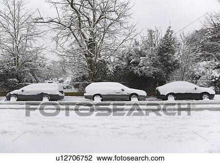 Three snow covered cars parked on road View Large Photo Image Stock Image - Three snow covered cars parked on road. Fotosearch