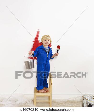 Toddler boy painting wall red. View Large Photo Image Stock Image - Toddler boy painting wall red.. Fotosearch