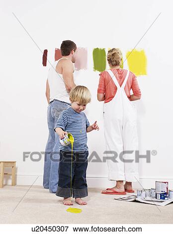Toddler boy pouring paint on carpet View Large Photo Image Stock Photo - Toddler boy pouring paint on carpet. Fotosearch