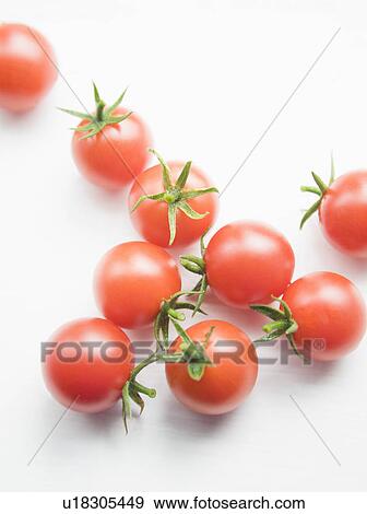 Stock Photo - Tomatoes against white. Fotosearch