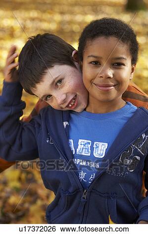 Stock Photograph - Two boys playing. Fotosearch
