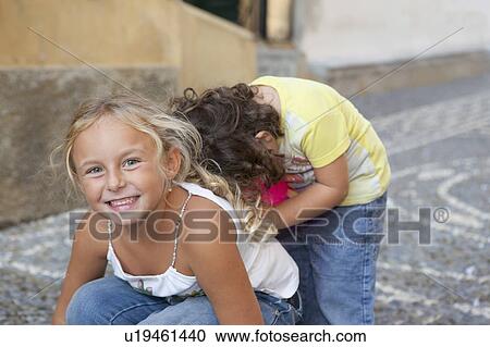 two children playing View Large Photo Image Stock Image - two children playing. Fotosearch