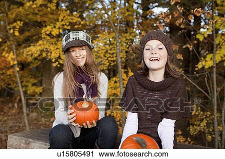 Two girls laughing View Large Photo Image Stock Image - Two girls laughing. Fotosearch