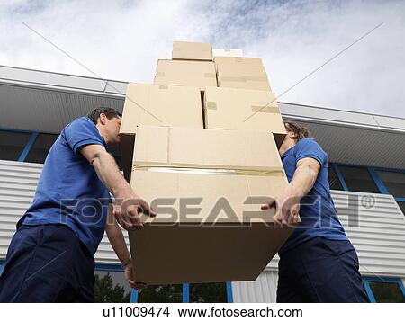 two men carrying boxes View Large Photo Image Picture - two men carrying boxes. Fotosearch