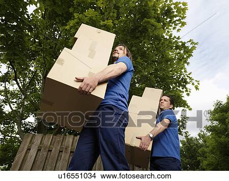 two men carrying boxes View Large Photo Image Picture - two men carrying boxes. Fotosearch