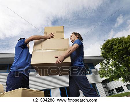 Stock Photo - two men carrying boxes. Fotosearch