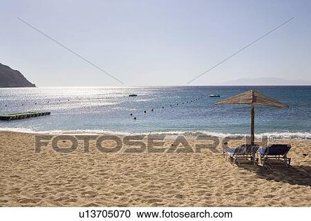 Two sunbeds on sandy beach View Large Photo Image Stock Image - Two sunbeds on sandy beach . Fotosearch