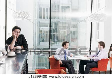 Stock Image - Waiter looking bored. Fotosearch