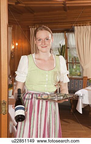 waitress with bottle of wine and glass View Large Photo Image Stock Photo - waitress with bottle of wine and glass. Fotosearch