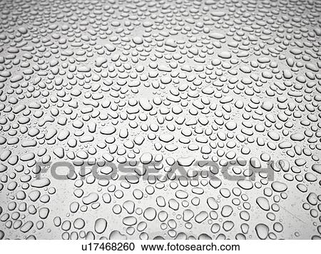Stock Image - Water droplets on metal. Fotosearch