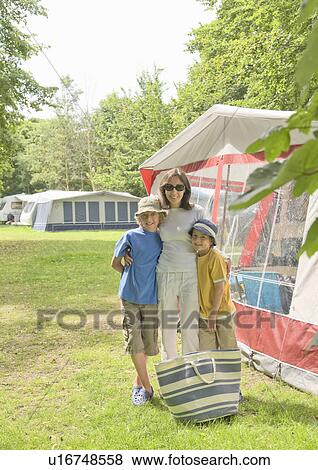 Woman and children next to tents View Large Photo Image Stock Photo - Woman and children next to tents. Fotosearch