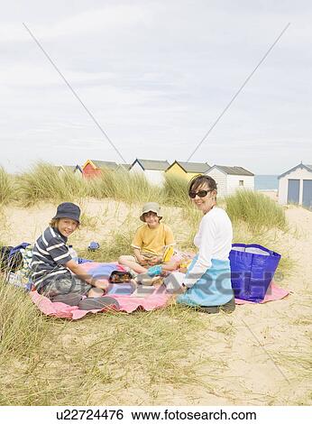 Woman and children picnic View Large Photo Image Stock Photograph - Woman and children picnic. Fotosearch