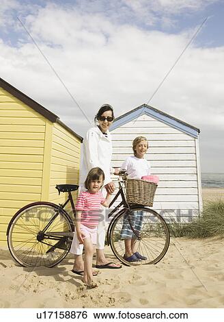 Woman and children with bike View Large Photo Image Stock Photograph - Woman and children with bike. Fotosearch