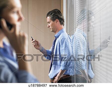 Woman and man on the phone View Large Photo Image Stock Photo - Woman and man on the phone. Fotosearch