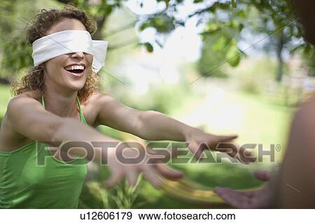 Stock Photo - woman blindfolded. Fotosearch