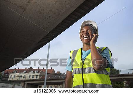 woman construction worker on phone View Large Photo Image Stock Photograph - woman construction worker on phone. Fotosearch