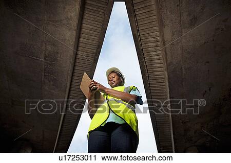woman documenting construction View Large Photo Image Stock Image - woman documenting construction. Fotosearch