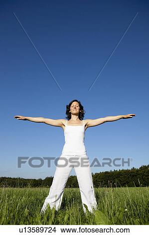 Woman Doing Yoga In Meadow View Large Photo Image Picture - Woman Doing Yoga In Meadow. Fotosearch