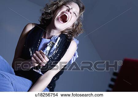 woman drinking champagne laughing View Large Photo Image Picture - woman drinking champagne laughing. Fotosearch