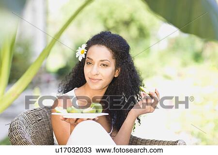 woman eating fresh fruits View Large Photo Image Stock Image - woman eating fresh fruits. Fotosearch