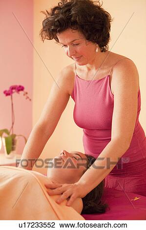 Stock Image - Woman getting a massage. Fotosearch