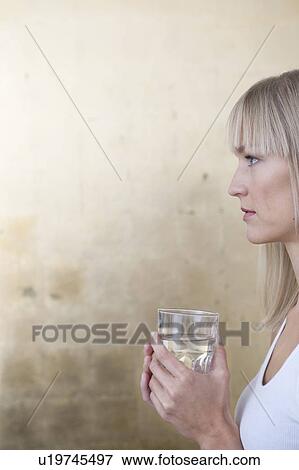 Stock Photo - woman holding glass. Fotosearch