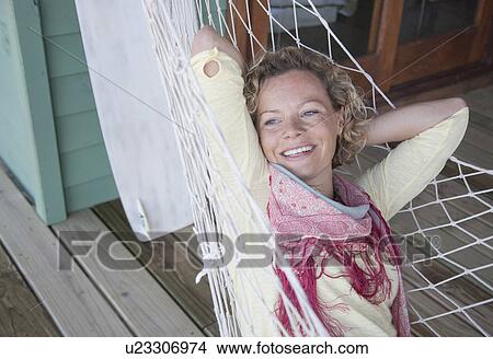 woman in a hammock, laughing View Large Photo Image Picture - woman in a hammock, laughing. Fotosearch