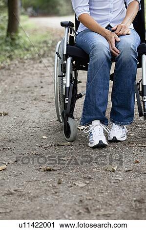 Woman in a wheelchair View Large Photo Image Stock Image - Woman in a wheelchair. Fotosearch