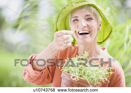Stock Photo - woman in garden. Fotosearch