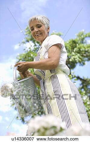 Stock Photo - woman in garden. Fotosearch