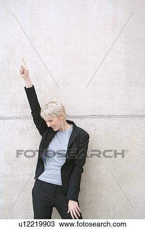 Stock Image - woman in suit laughing. Fotosearch