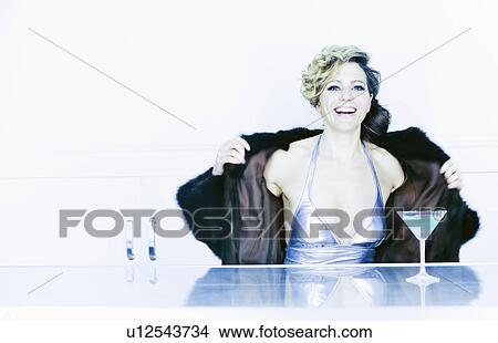 woman in swimsuit removing fur coat View Large Photo Image Picture - woman in swimsuit removing fur coat. Fotosearch