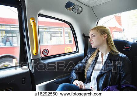 Woman in taxi View Large Photo Image Stock Image - Woman in taxi. Fotosearch