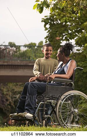woman in wheelchair with child View Large Photo Image Picture - woman in wheelchair with child. Fotosearch