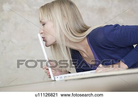 woman kissing laptop View Large Photo Image Stock Image - woman kissing laptop. Fotosearch