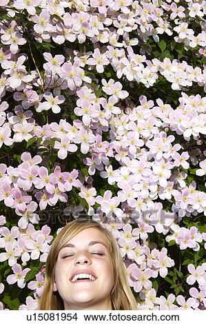 Woman laying down in the flowers View Large Photo Image Picture - Woman laying down in the flowers. Fotosearch