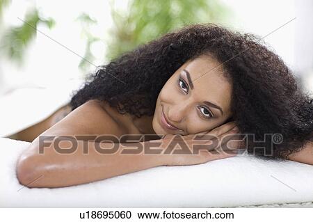 woman lies on a massage bed View Large Photo Image Stock Image - woman lies on a massage bed. Fotosearch