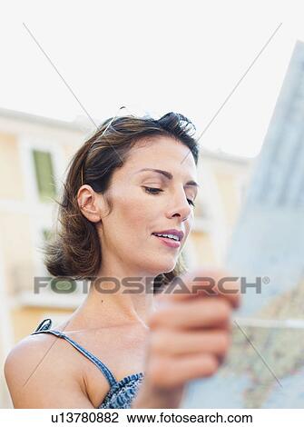 woman looking at a map View Large Photo Image Stock Image - woman looking at a map. Fotosearch
