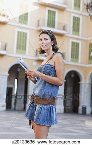 woman looking at map View Large Photo Image Stock Photograph - woman looking at map. Fotosearch