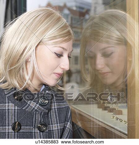 woman looking at shop window View Large Photo Image Stock Image - woman looking at shop window. Fotosearch